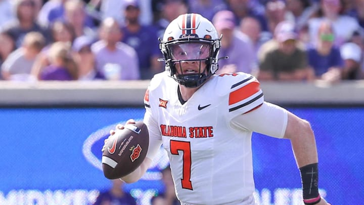 Sep 28, 2024; Manhattan, Kansas, USA; Oklahoma State Cowboys quarterback Alan Bowman (7) scrambles against the Kansas State Wildcats during the second quarter at Bill Snyder Family Football Stadium. Mandatory Credit: Scott Sewell-Imagn Images