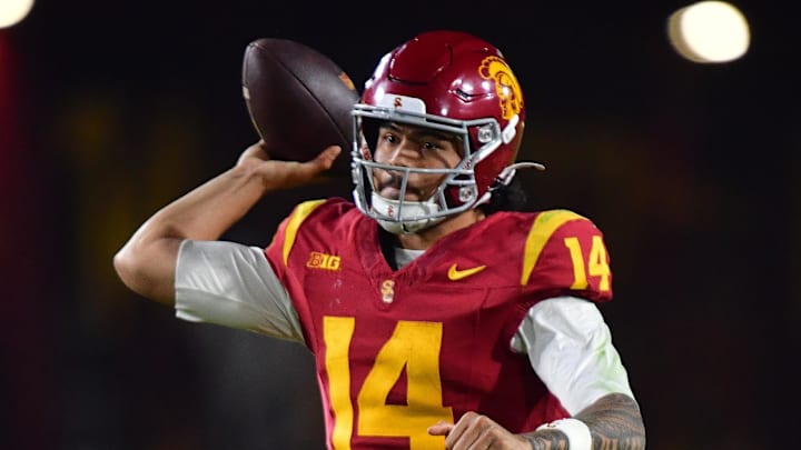 Nov 7, 2025; Los Angeles, California, USA; Southern California Trojans quarterback Jayden Maiava (14) throws against the Northwestern Wildcats during the second half at the Los Angeles Memorial Coliseum. Mandatory Credit: Gary A. Vasquez-Imagn Images
