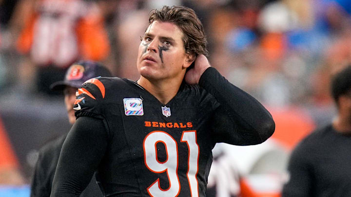 Cincinnati Bengals defensive end Trey Hendrickson watches a replay as the Detroit Lions celebrate a touchdown 