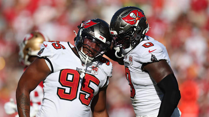 Tampa Bay Buccaneers linebacker Yaya Diaby (0) and defensive end Elijah Roberts (95) react after a sack during the first quarter against the San Francisco 49ers.