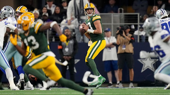 Green Bay Packers quarterback Jordan Love (10) looks for a receiver during the first quarter of the wild card playoff game Sunday, January 14, 2024 at AT&T Stadium in Arlington, Texas. The Green Bay Packers beat the Dallas Cowboys 48-32.