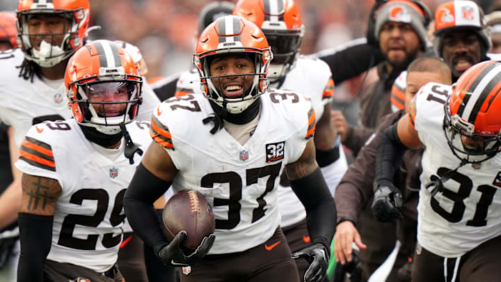 Cleveland Browns safety D'Anthony Bell (37), center, celebrates an interception in the first quarter during a Week 18 NFL football game between the Cleveland Browns at Cincinnati Bengals, Sunday, Jan. 7, 2024, at Paycor Stadium in Cincinnati.
