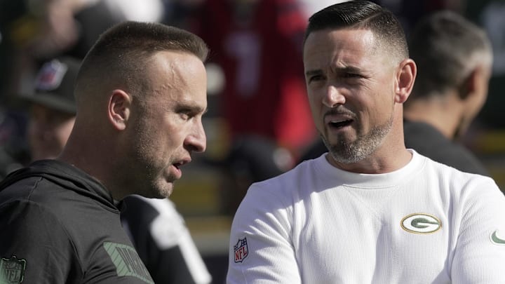 Green Bay Packers defensive coordinator Jeff Hafley, left, talks with head coach Matt LaFleur before their game against the Houston Texans at Lambeau Field.