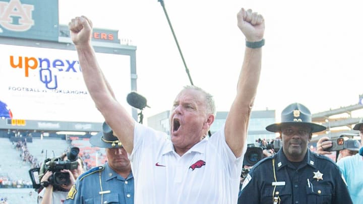 Arkansas Razorbacks coach Sam Pittman cheers with fans as he walks off the field as Auburn Tigers take on Arkansas Razorbacks at Jordan-Hare Stadium in Auburn, Ala.