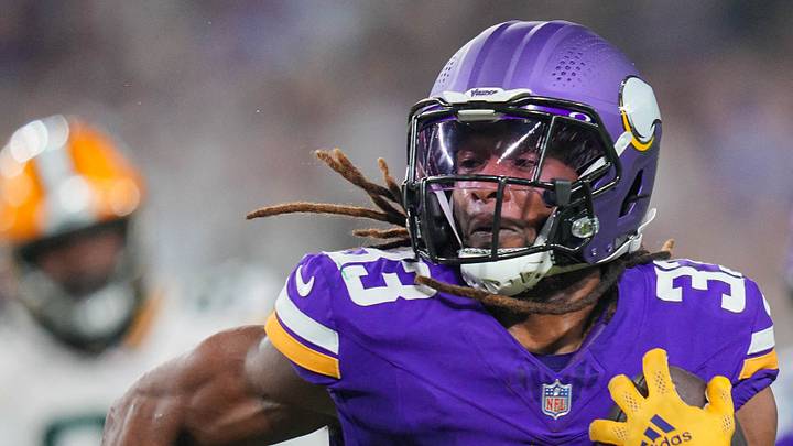 Minnesota Vikings running back Aaron Jones (33) runs with the ball against the Green Bay Packers in 2024. Minnesota Vikings running back Aaron Jones (33) runs with the ball against the Green Bay Packers in 2024.