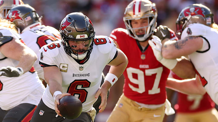 Tampa Bay Buccaneers quarterback Baker Mayfield (6) and San Francisco 49ers defensive end Nick Bosa (97)