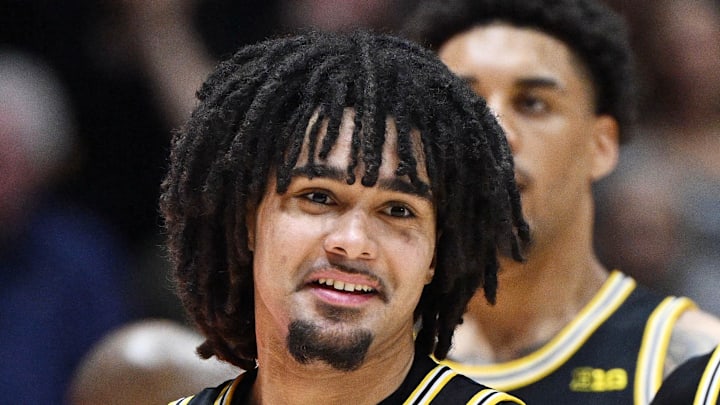 Feb 17, 2026; West Lafayette, Indiana, USA; Michigan Wolverines guard Elliot Cadeau (3) shares a moment with Michigan Wolverines guard Trey McKenney (1) during the second half against the Purdue Boilermakers at Mackey Arena. Mandatory Credit: Marc Lebryk-Imagn Images