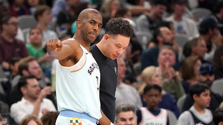 Mar 21, 2025; San Antonio, Texas, USA; San Antonio Spurs guard Chris Paul (3) talks to San Antonio Spurs head coach Mitch Johnson during the fourth quarter against the Philadelphia 76ers at Frost Bank Center.