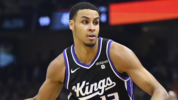 Feb 5, 2024; Cleveland, Ohio, USA; Sacramento Kings forward Keegan Murray (13) brings the ball up court in the second quarter against the Cleveland Cavaliers at Rocket Mortgage FieldHouse. Mandatory Credit: David Richard-Imagn Images