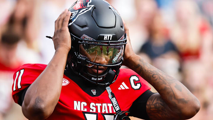 Sep 27, 2025; Raleigh, North Carolina, USA; North Carolina State Wolfpack quarterback CJ Bailey (11) warms up during the warmups of the game against Virginia Tech Hokies at Carter-Finley Stadium. Mandatory Credit: Jaylynn Nash-Imagn Images Sep 27, 2025; Raleigh, North Carolina, USA; North Carolina State Wolfpack quarterback CJ Bailey (11) warms up during the warmups of the game against Virginia Tech Hokies at Carter-Finley Stadium. Mandatory Credit: Jaylynn Nash-Imagn Images