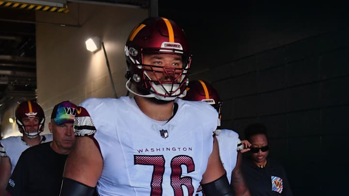 Oct 1, 2023; Philadelphia, Pennsylvania, USA; Washington Commanders offensive tackle Sam Cosmi (76) leads his team in the tunnel against the Philadelphia Eagles at Lincoln Financial Field. Mandatory Credit: Eric Hartline-Imagn Images