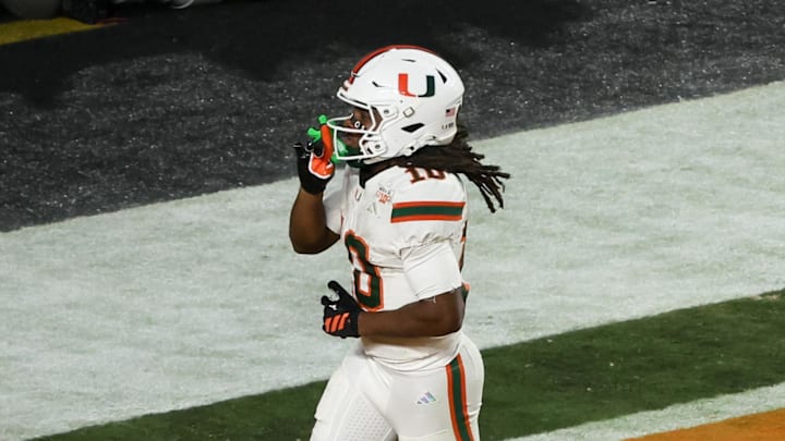 Jan 19, 2026; Miami Gardens, FL, USA; Miami Hurricanes wide receiver Malachi Toney (10) celebrates after scoring a touchdown against the Indiana Hoosiers in the fourth quarter during the College Football Playoff National Championship game at Hard Rock Stadium. Mandatory Credit: Kim Klement Neitzel-Imagn Images