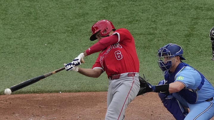 Aug 24, 2024; Toronto, Ontario, CAN; Los Angeles Angels third baseman Anthony Rendon (6) makes contact with a ball against the Toronto Blue Jays during the seventh inning at Rogers Centre. Mandatory Credit: John E. Sokolowski-Imagn Images