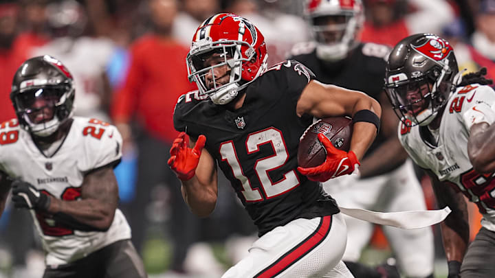 Oct 3, 2024; Atlanta, Georgia, USA; Atlanta Falcons wide receiver KhaDarel Hodge (12) runs for the game winning touchdown against the Tampa Bay Buccaneers in overtime at Mercedes-Benz Stadium. Mandatory Credit: Dale Zanine-Imagn Images