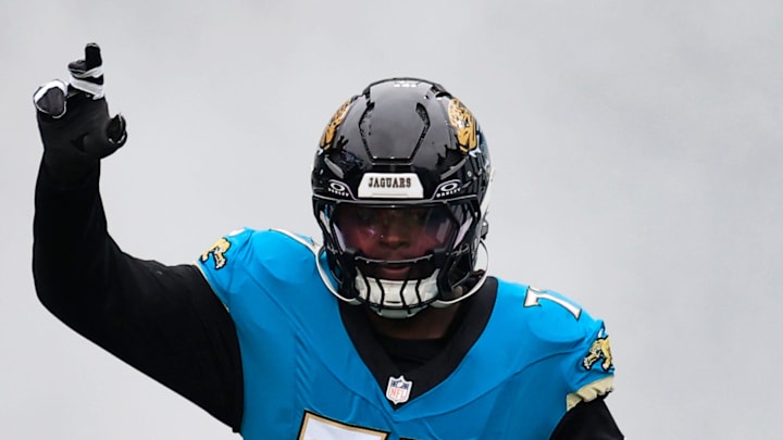 Jacksonville Jaguars offensive tackle Anton Harrison (77) runs on the field before an NFL football matchup at EverBank Stadium, Sunday, Jan. 4, 2026, in Jacksonville, Fla. The Jaguars defeated the Titans 41-7, capturing the AFC South title. [Corey Perrine/Florida Times-Union]