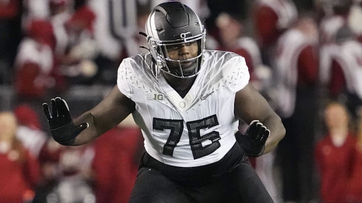 Nov 16, 2024; Madison, Wisconsin, USA;  Oregon Ducks offensive linenam Josh Conerly Jr. (76) during the game against the Wisconsin Badgers at Camp Randall Stadium. Mandatory Credit: Jeff Hanisch-Imagn Images