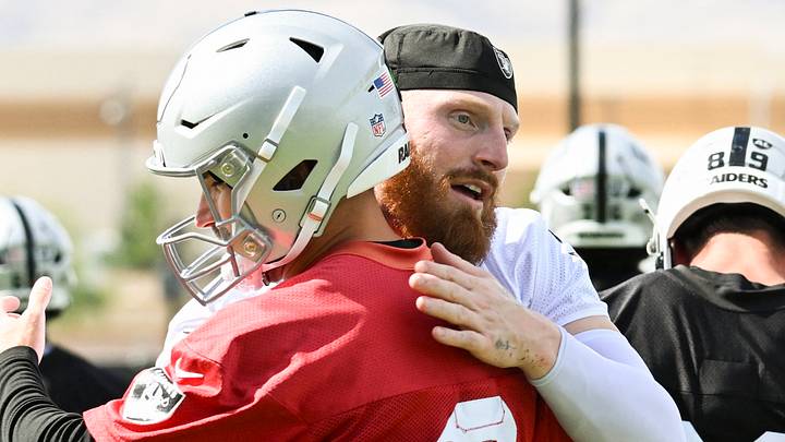 Jun 3, 2026; Henderson, NV, USA; Las Vegas Raiders defensive end Maxx Crosby (98) hugs quarterback Kirk Cousins (8) during organized team activities at Intermountain Health Performance Center. Mandatory Credit: Candice Ward-Imagn Images