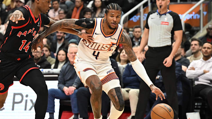 Mar 13, 2026; Toronto, Ontario, CAN;  Phoenix Suns guard Jalen Green (4) dribbles the ball as Toronto Raptors guard Ja'Kobe Walter (14) defends in the first half at Scotiabank Arena. Mandatory Credit: Dan Hamilton-Imagn Images