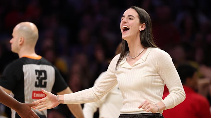 Aug 29, 2025; Los Angeles, California, USA; Indiana Fever guard Caitlin Clark (22) greets a teammate during the second half against the Los Angeles Sparks at Crypto.com Arena. Mandatory Credit: Kiyoshi Mio-Imagn Images