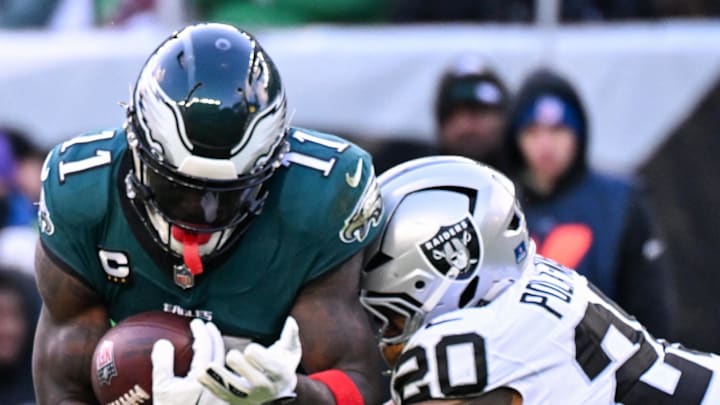 Dec 14, 2025; Philadelphia, Pennsylvania, USA; Philadelphia Eagles wide receiver A.J. Brown (11) is tackled by Las Vegas Raiders safety Isaiah Pola-Mao (20) during the third quarter at Lincoln Financial Field. Mandatory Credit: Eric Hartline-Imagn Images Dec 14, 2025; Philadelphia, Pennsylvania, USA; Philadelphia Eagles wide receiver A.J. Brown (11) is tackled by Las Vegas Raiders safety Isaiah Pola-Mao (20) during the third quarter at Lincoln Financial Field. Mandatory Credit: Eric Hartline-Imagn Images