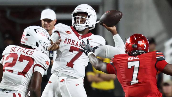 Arkansas Razorbacks quarterback KJ Jackson (7) passes the ball as Utah Utes linebacker Johnathan Hall (7) rushes during the first quarter at Rice-Eccles Stadium. Arkansas Razorbacks quarterback KJ Jackson (7) passes the ball as Utah Utes linebacker Johnathan Hall (7) rushes during the first quarter at Rice-Eccles Stadium.