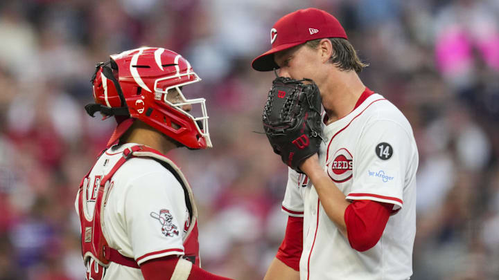 Cincinnati Reds catcher Jose Trevino talks with pitcher Brady Singer