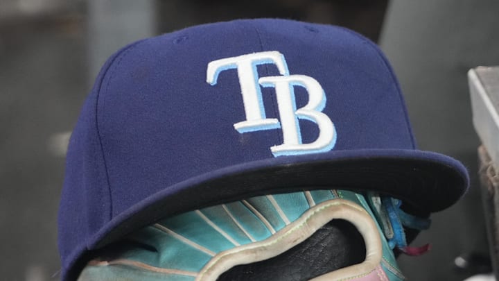 Sep 26, 2025; Toronto, Ontario, CAN; The hat and glove of Tampa Bay Rays third baseman Junior Caminero (13) in the dugout during the game against the Toronto Blue Jays at Rogers Centre. 