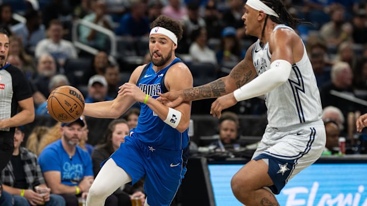 Mar 27, 2025; Orlando, Florida, USA; Dallas Mavericks guard-forward Klay Thompson (31) dribbles the ball against Orlando Magic forward Paolo Banchero (5) in the first quarter at Kia Center. Mandatory Credit: Jeremy Reper-Imagn Images Mar 27, 2025; Orlando, Florida, USA; Dallas Mavericks guard-forward Klay Thompson (31) dribbles the ball against Orlando Magic forward Paolo Banchero (5) in the first quarter at Kia Center. Mandatory Credit: Jeremy Reper-Imagn Images
