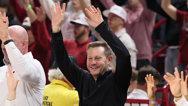 Arkansas Razorbacks coach Ryan Silverfield “Calls the Hogs” during the second half against the James Madison Dukes at Bud Walton Arena in Fayetteville, Ark. Arkansas Razorbacks coach Ryan Silverfield “Calls the Hogs” during the second half against the James Madison Dukes at Bud Walton Arena in Fayetteville, Ark.