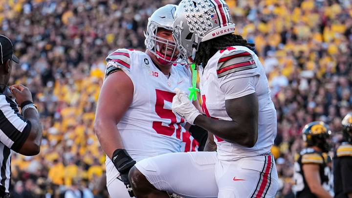 Ohio State Buckeyes wide receiver Jeremiah Smith (4) strikes a Heisman pose with offensive lineman Luke Montgomery (51) after scoring a touchdown during the NCAA football game at Kinnick Stadium in Iowa City on Oct. 3, 2026. Ohio State on 31-14.