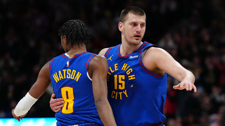 Mar 5, 2024; Denver, Colorado, USA; Denver Nuggets forward Peyton Watson (8) and center Nikola Jokic (15) react in the first half against the Phoenix Suns at Ball Arena.