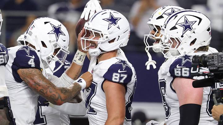 Dallas Cowboys TE Jake Ferguson celebrates with teammates after scoring a touchdown against the Washington Commanders. Dallas Cowboys TE Jake Ferguson celebrates with teammates after scoring a touchdown against the Washington Commanders.