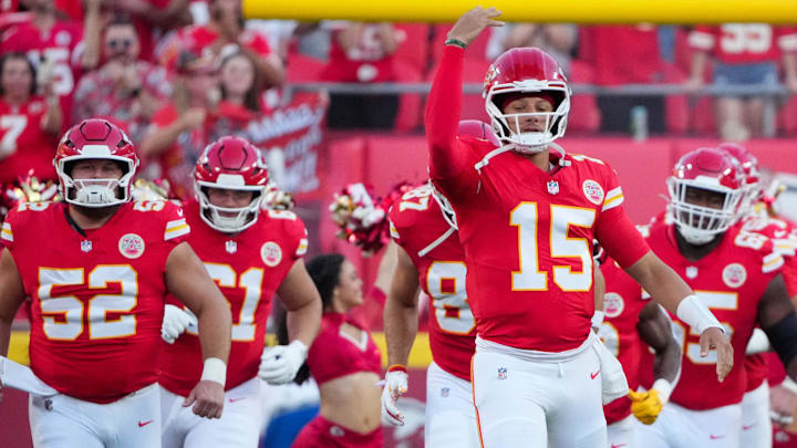 Aug 22, 2025; Kansas City, Missouri, USA; Kansas City Chiefs quarterback Patrick Mahomes (15) runs on field with the team against the Chicago Bears during the first half of the game at GEHA Field at Arrowhead Stadium. Mandatory Credit: Denny Medley-Imagn Images