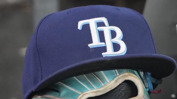 Sep 26, 2025; Toronto, Ontario, CAN; The hat and glove of Tampa Bay Rays third baseman Junior Caminero (13) in the dugout during the game against the Toronto Blue Jays at Rogers Centre. 