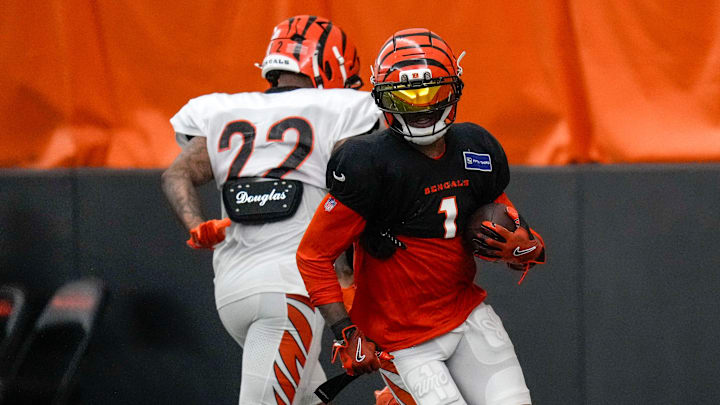 Cincinnati Bengals wide receiver Ja'Marr Chase (1) runs with a catch during a preseason training camp practice in downtown Cincinnati on Thursday, July 31, 2025.