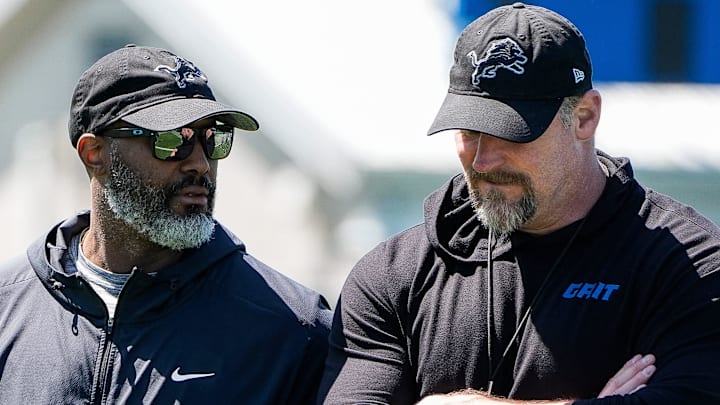 Detroit Lions general manager Brad Holmes, left, talks to head coach Dan Campbell 