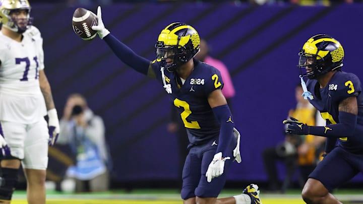 Jan 8, 2024; Houston, TX, USA; Michigan Wolverines defensive back Will Johnson (2) celebrates with defensive back Keon Sabb (3) after a turnover against the Washington Huskies during the third quarter in the 2024 College Football Playoff national championship game at NRG Stadium. Mandatory Credit: Thomas Shea-USA TODAY Sports