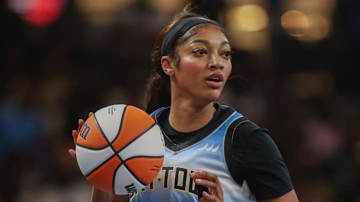 Chicago Sky forward Angel Reese dribbles the ball. 