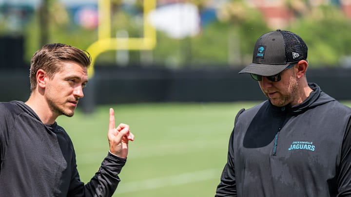 Jacksonville Jaguars general manager James Gladstone, left, talks with Jacksonville Jaguars head coach Liam Coen, right, after the. Jacksonville Jaguars’ mandatory minicamp Tuesday June 10, 2025 at the Miller Electric Center in Jacksonville, Fla. [Doug Engle/Florida Times-Union]