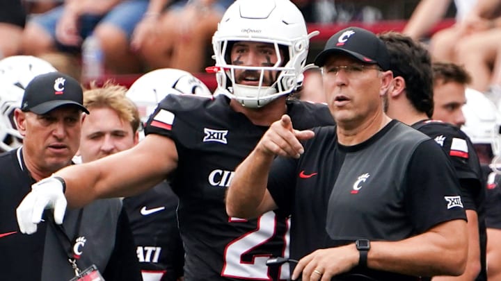 Cincinnati Bearcats head coach Scott Satterfield speaks with players during a NCAA men’s college football game between the Cincinnati Bearcats and Northwestern State Demons, Saturday, Sept. 13, 2025, at Nippert Stadium in Cincinnati.