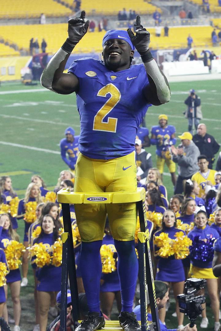 Pittsburgh Panthers running back Israel Abanikanda leads the PITT marching band after defeating the Virginia Tech Hokies 