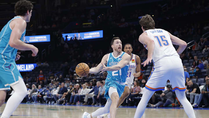 Jan 5, 2026; Oklahoma City, Oklahoma, USA; Charlotte Hornets guard Pat Connaughton (21) passes against the Oklahoma City Thunder during the second half at Paycom Center. Mandatory Credit: Alonzo Adams-Imagn Images