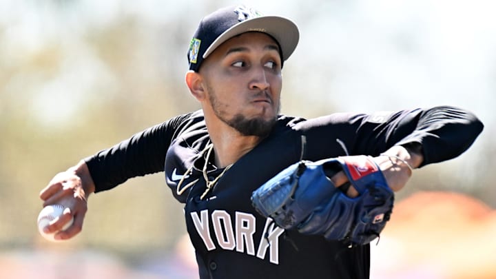 New York Yankees starting pitcher Elmer Rodriguez (76) throws a pitch in the first inning against the Baltimore Orioles during spring training at Ed Smith Stadium.