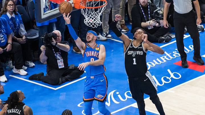 May 18, 2026; Oklahoma City, Oklahoma, USA; Oklahoma City Thunder guard Alex Caruso (9) shoots while defended by San Antonio Spurs center Victor Wembanyama (1) in double overtime during game one of the western conference finals for the 2026 NBA playoffs at Paycom Center. Mandatory Credit: Brett Rojo-Imagn Images May 18, 2026; Oklahoma City, Oklahoma, USA; Oklahoma City Thunder guard Alex Caruso (9) shoots while defended by San Antonio Spurs center Victor Wembanyama (1) in double overtime during game one of the western conference finals for the 2026 NBA playoffs at Paycom Center. Mandatory Credit: Brett Rojo-Imagn Images