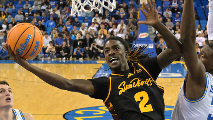 Dec 17, 2025; Los Angeles, California, USA;  Arizona State Sun Devils guard Anthony Johnson (2) drives past UCLA Bruins guard Eric Dailey Jr. (3) for a basket in the second half at Pauley Pavilion presented by Wescom Financial. Mandatory Credit: Jayne Kamin-Oncea-Imagn Images 