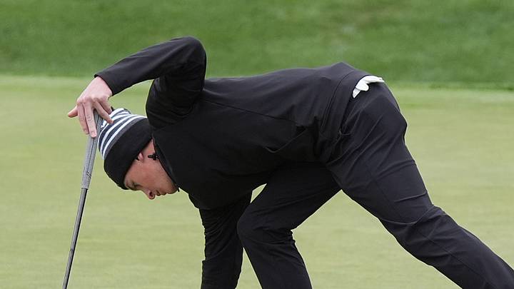 Waukee’ Jonathan Ward get the ball from the hole after a putt to the 9th hole in the class 4A boys State golf tournament at Hyperion Field Club on Oct. 13, 2025 in Johnston, Iowa. Waukee’ Jonathan Ward get the ball from the hole after a putt to the 9th hole in the class 4A boys State golf tournament at Hyperion Field Club on Oct. 13, 2025 in Johnston, Iowa.