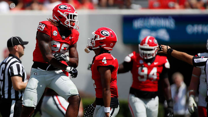 Georgia linebacker Gabe Harris (29) celebrates after making a stop on fourth down during the second half of a NCAA college football game against Ball State in Athens, Ga., on Saturday, Sept. 9, 2023. Georgia won 45-3.