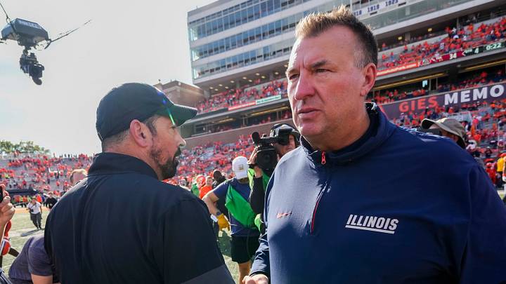 Ohio State Buckeyes head coach Ryan Day shakes hands with Illinois Fighting Illini head coach Bret Bielema following the Buckeyes' 34-16 win in the NCAA football game at Gies Memorial Stadium in Champaign on Oct. 11, 2025. Ohio State Buckeyes head coach Ryan Day shakes hands with Illinois Fighting Illini head coach Bret Bielema following the Buckeyes' 34-16 win in the NCAA football game at Gies Memorial Stadium in Champaign on Oct. 11, 2025.