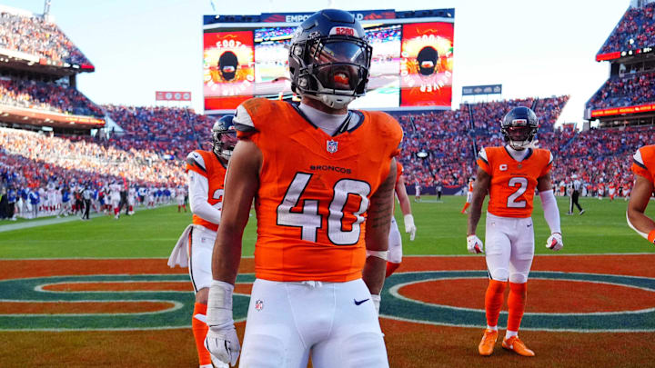Oct 19, 2025; Denver, Colorado, USA; Denver Broncos linebacker Justin Strnad (40) celebrates after a touchdown during the second half against the New York Giants at Empower Field at Mile High. 