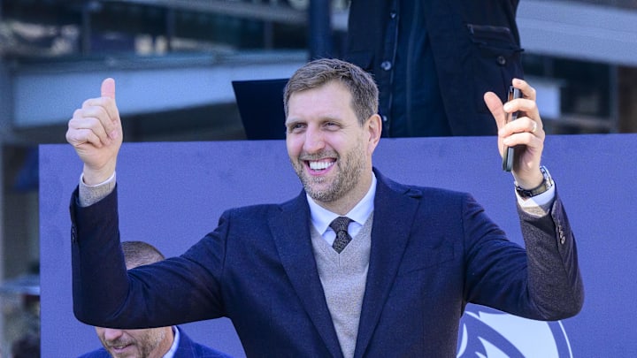 Dec 25, 2022; Dallas, Texas, USA; Former Dallas Mavericks power forward Dirk Nowitzki waves to the crowd during the ceremony for the unveiling of a statue in his honor at before the game between the Dallas Mavericks and the Los Angeles Lakers American Airlines Center . Mandatory Credit: Jerome Miron-Imagn Images